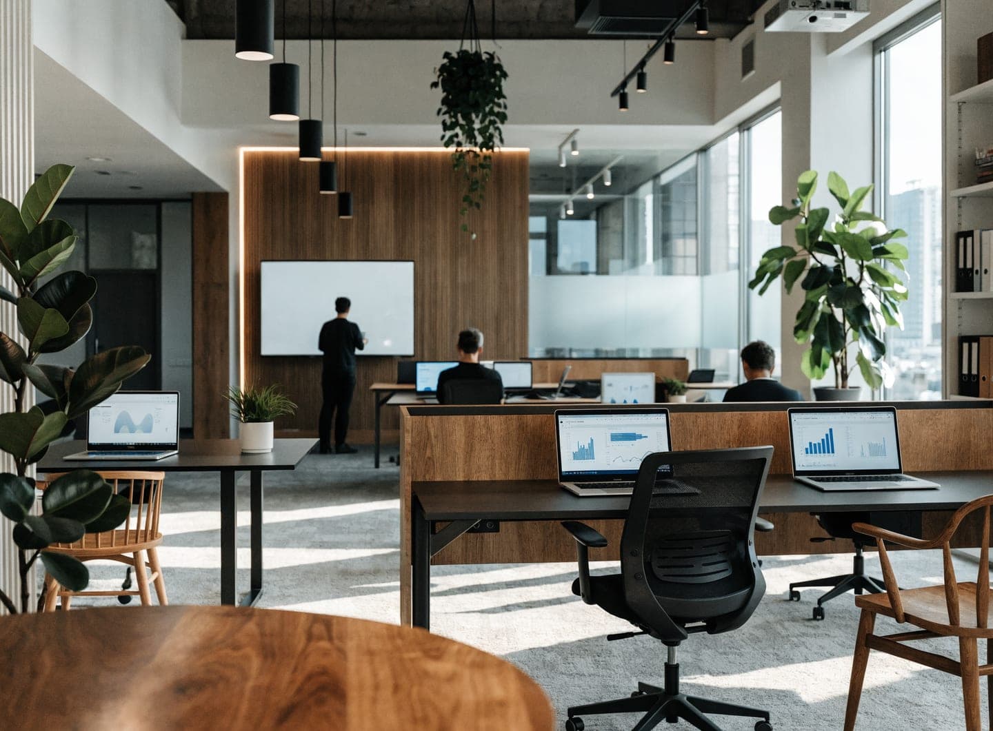 Modern hospitality technology workspace with analytics dashboards